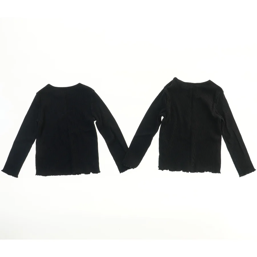 Langærmet sort top fra H&M (str. 104)