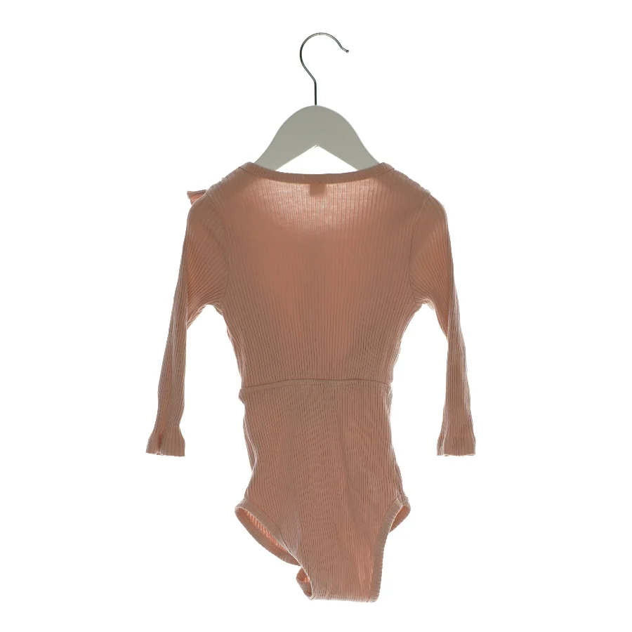 Bodystocking med pynteknapper (str. 80)