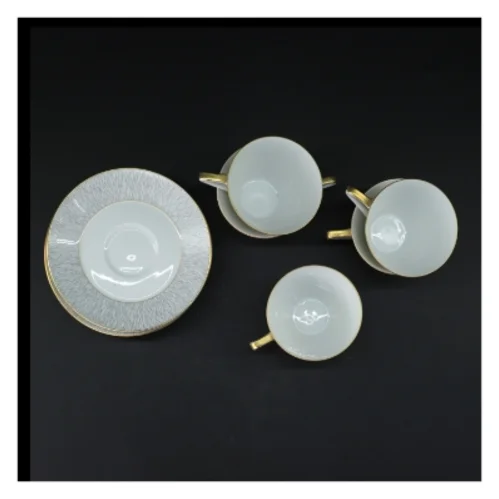 Koh-I-Noor kaffekopper med undertallerkner fra Königl pr. Tettau(str. 5 kopper. ø. 8 cm. længde. 6,5 cm. 6 undertallerkner. ø. 14 cm)