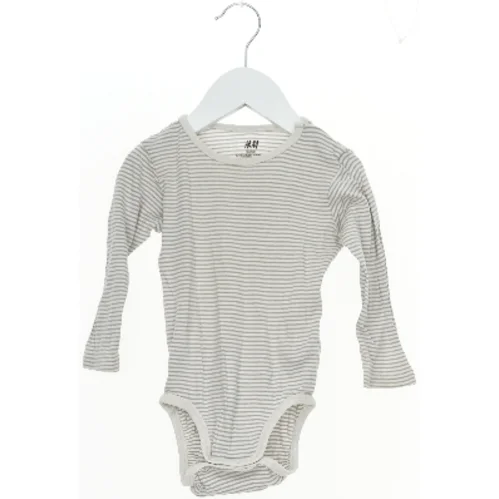 Langærmet bodystocking med striber fra H&M (str. 80)