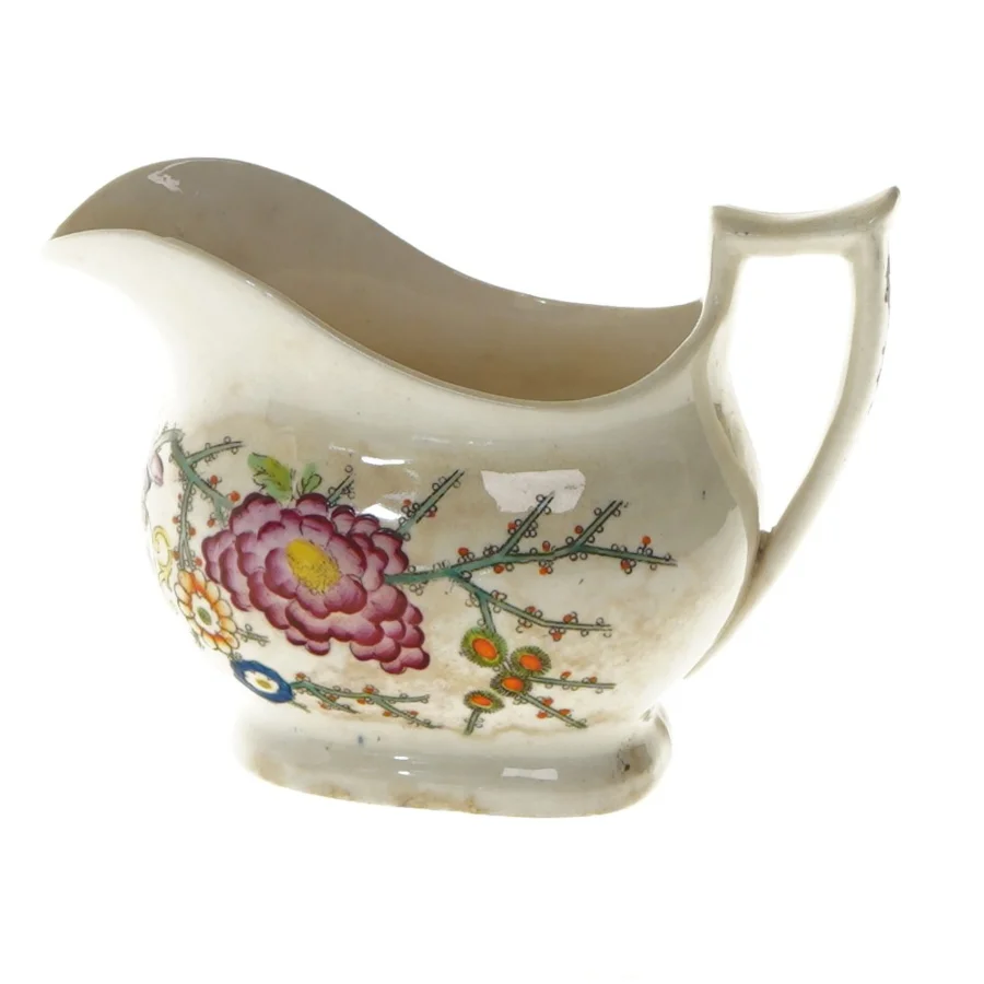 Porcelænsflødekande med blomstermotiv (str. 14,5x10 cm)