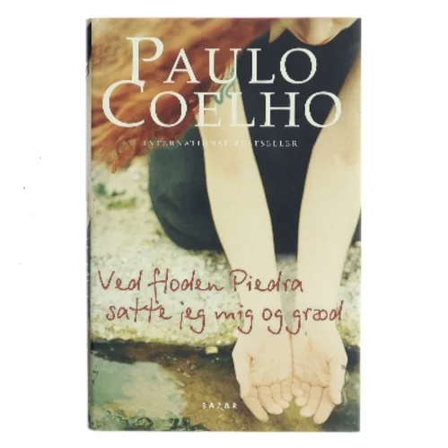 Ved floden Piedra satte jeg mig og græd af Paulo Coelho (Bog)