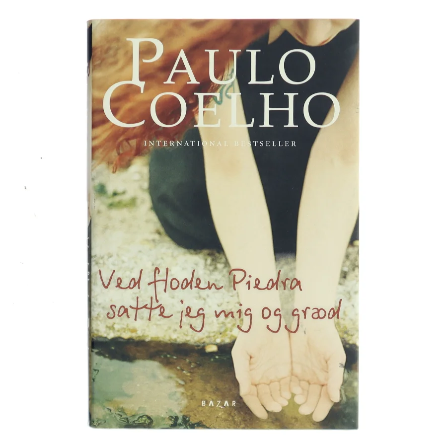 Ved floden Piedra satte jeg mig og græd af Paulo Coelho (Bog)
