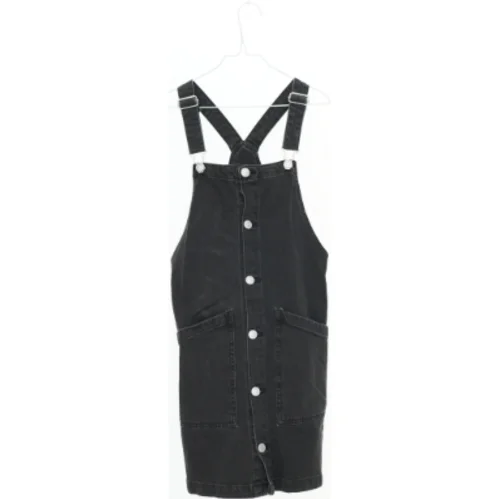 Sort buksedragt fra H&M (str. 146)