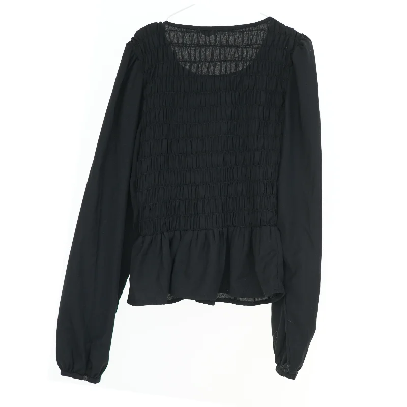 Sort langærmet bluse fra Pigalle (str. XS)