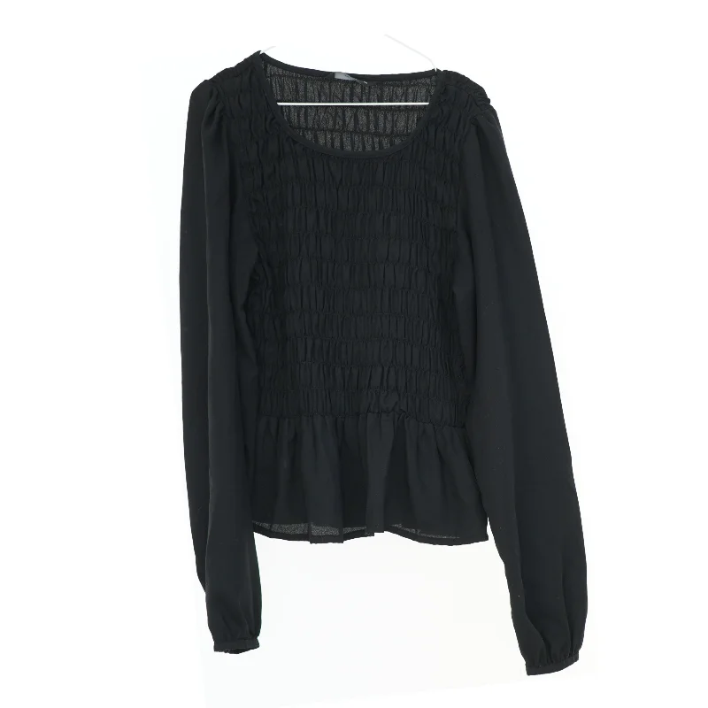 Sort langærmet bluse fra Pigalle (str. XS)