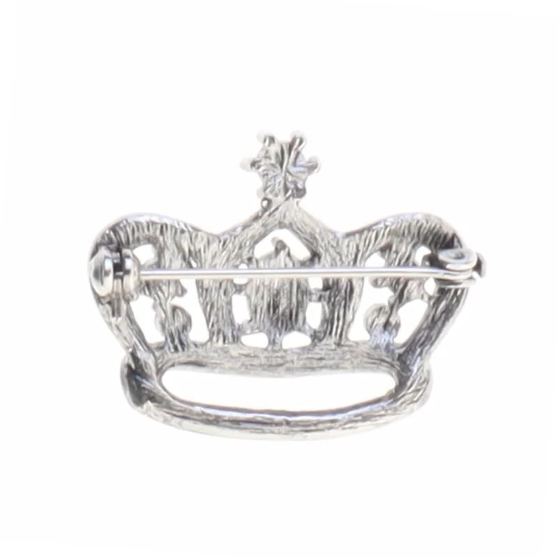 Broche i form af en krone med rhinsten og lilla sten (str. 3,1 x 2,5 cm)