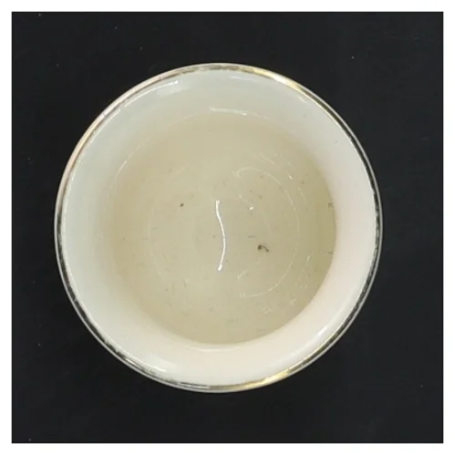 Lille porcelænskop med blomstermotiv (str. Ø 5 cm længde 5,5 cm)