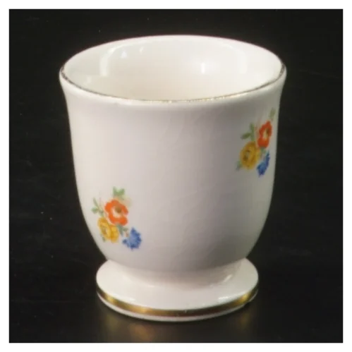 Lille porcelænskop med blomstermotiv (str. Ø 5 cm længde 5,5 cm)
