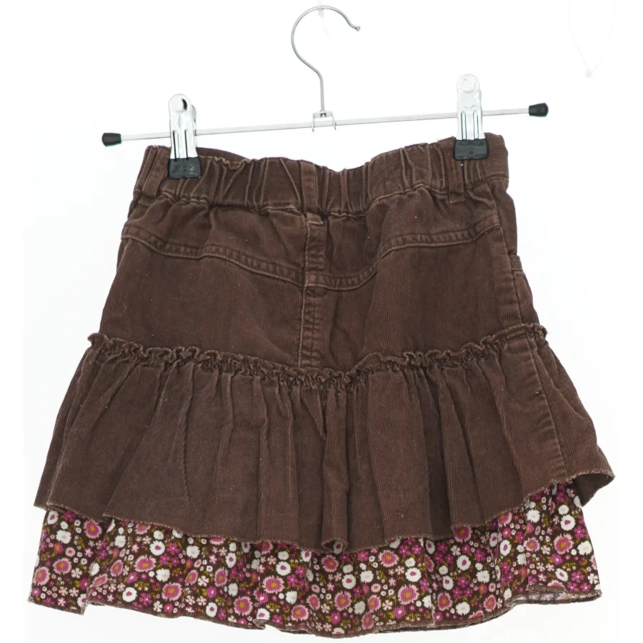 Brun nederdel med blomsterprint fra H&M (str. 116)