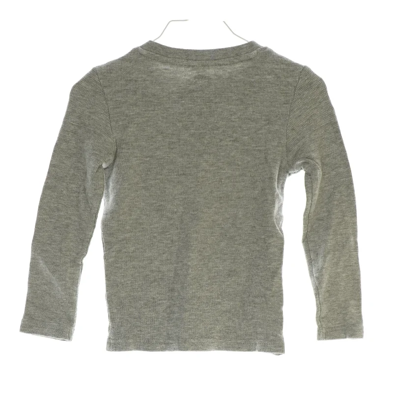 Langærmet bluse med lomme i (str. 116)