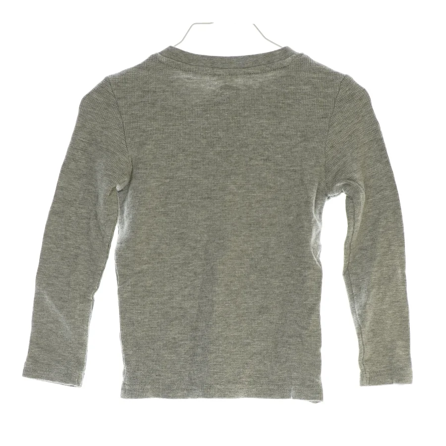 Langærmet bluse med lomme i (str. 116)