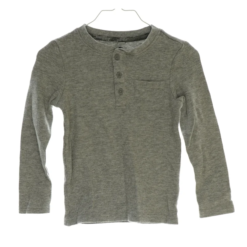 Langærmet bluse med lomme i (str. 116)