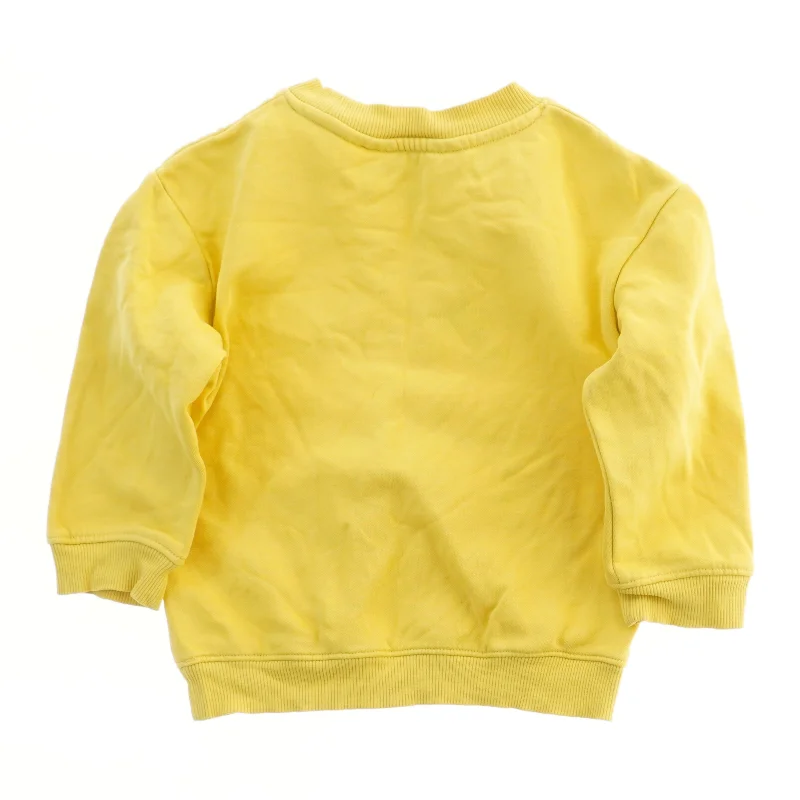 Gul sweatshirt med tryk fra H&M (str. 92)