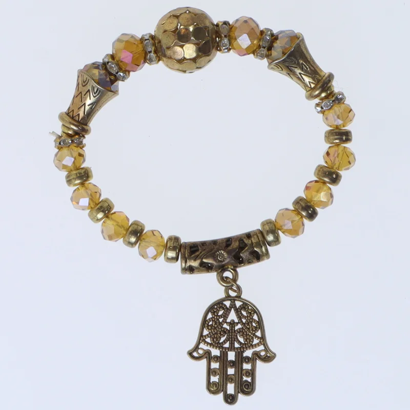 Armbånd med dekorativ vedhæng (str. Ø 7 cm)