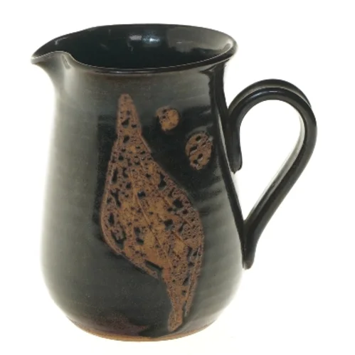 Keramikkande med håndtag fra Ravnild (str. Ø 10 cm længde 15 cm)