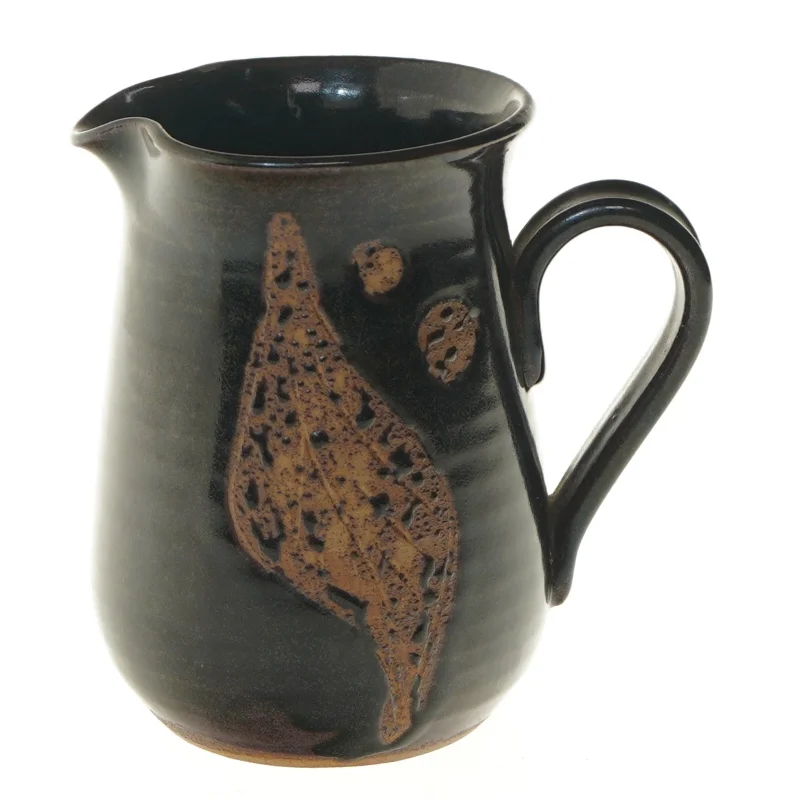 Keramikkande med håndtag fra Ravnild (str. Ø 10 cm længde 15 cm)