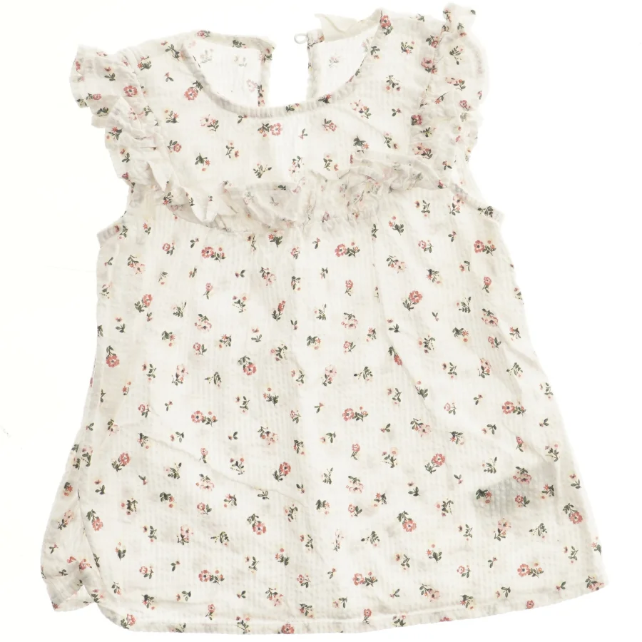 Blomstret bluse med flæser fra H&M (str. 92)