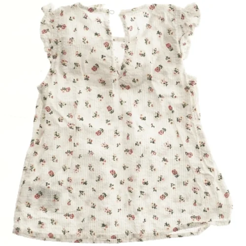 Blomstret bluse med flæser fra H&M (str. 92)