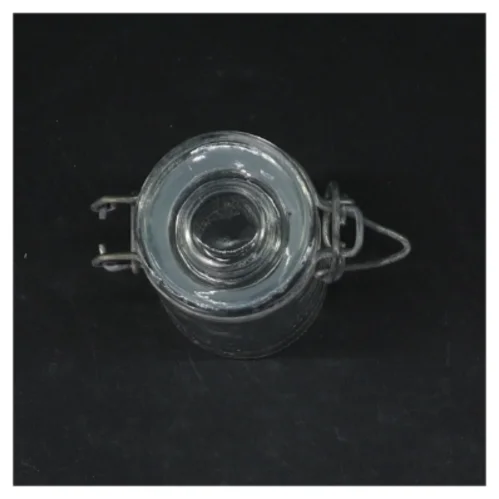 Glasbeholder med lås (str. Ø. 4,5 cm. længde, 8,5 cm)