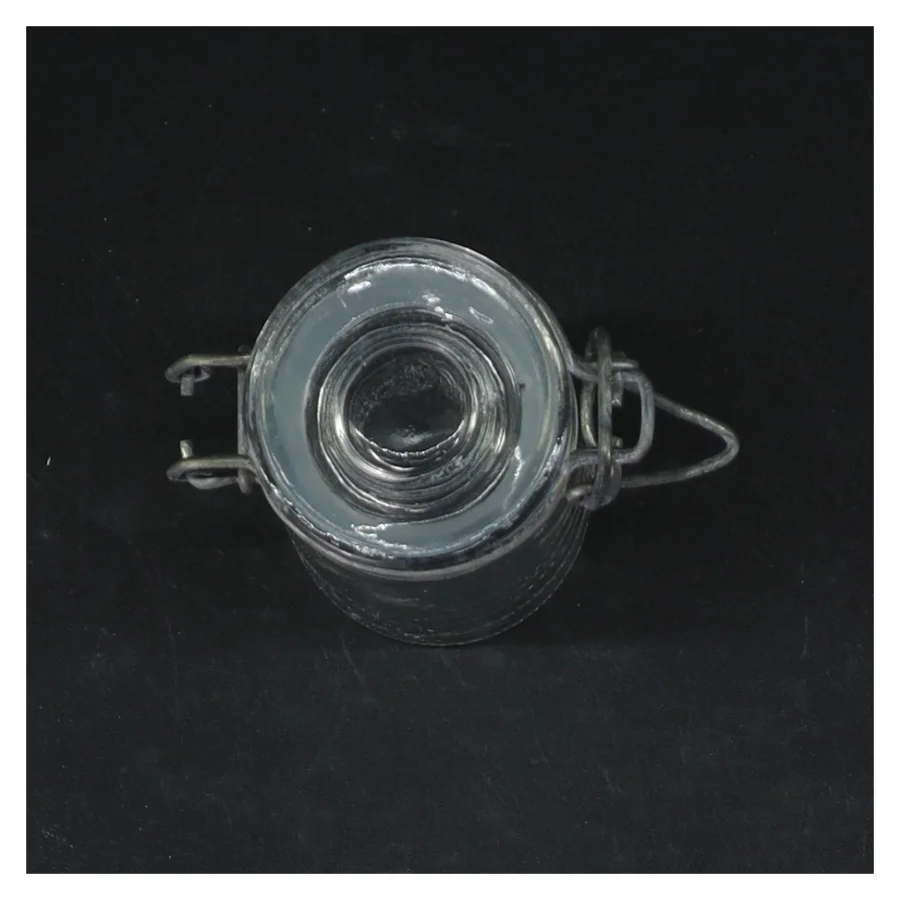 Glasbeholder med lås (str. Ø. 4,5 cm. længde, 8,5 cm)