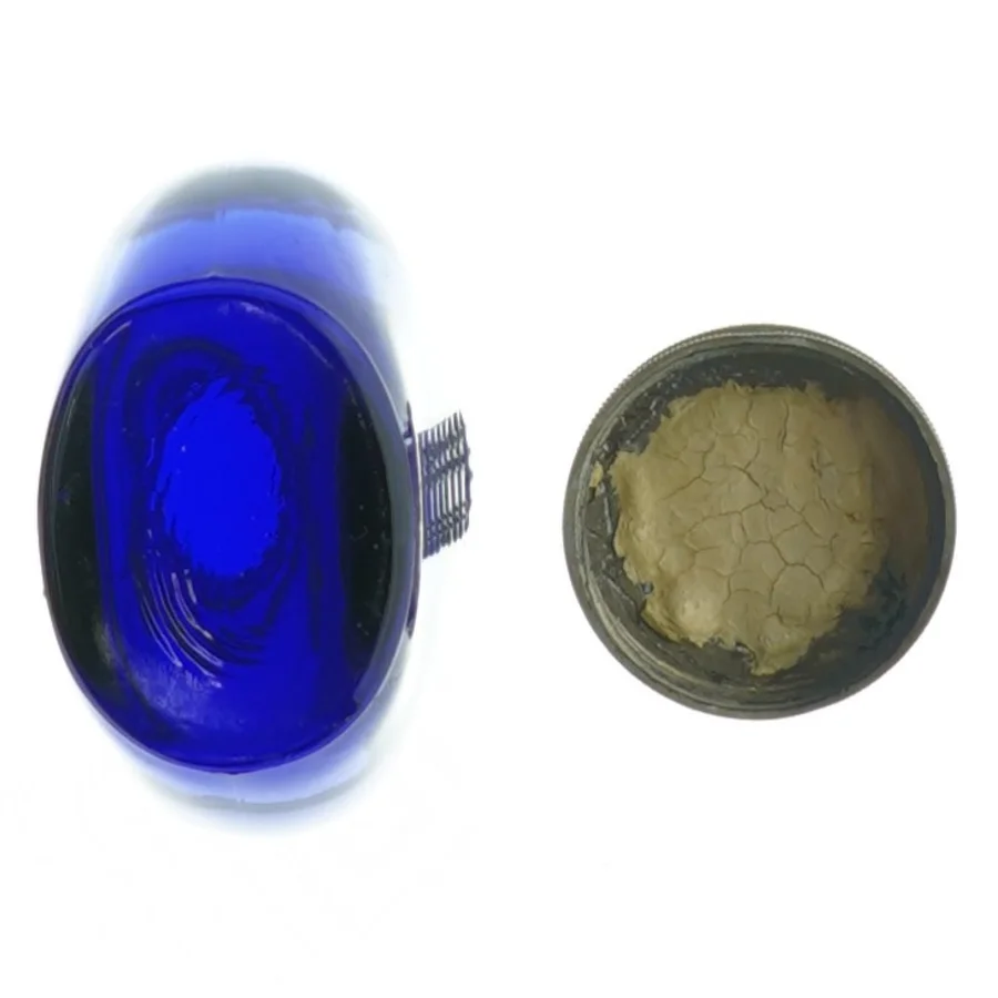 Gammel Blå glasflaske med måleenheder (str. H. 9 cm. b. 7 cm)