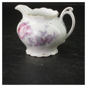 Porcelænsflødekande med blomstermotiv (str. 7,5x9 cm)