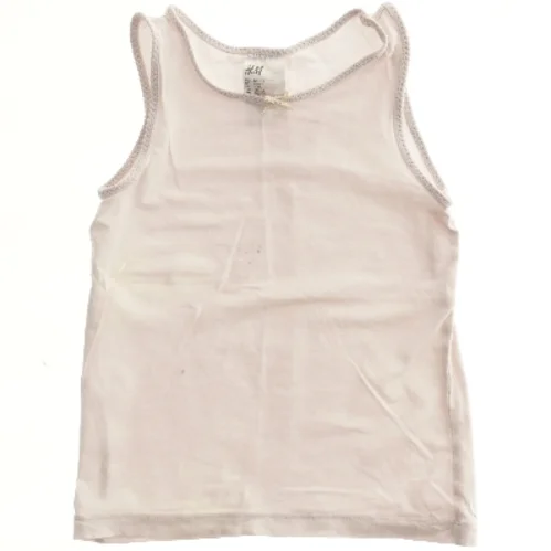 Lyserød tanktop fra H&M (str. 128)