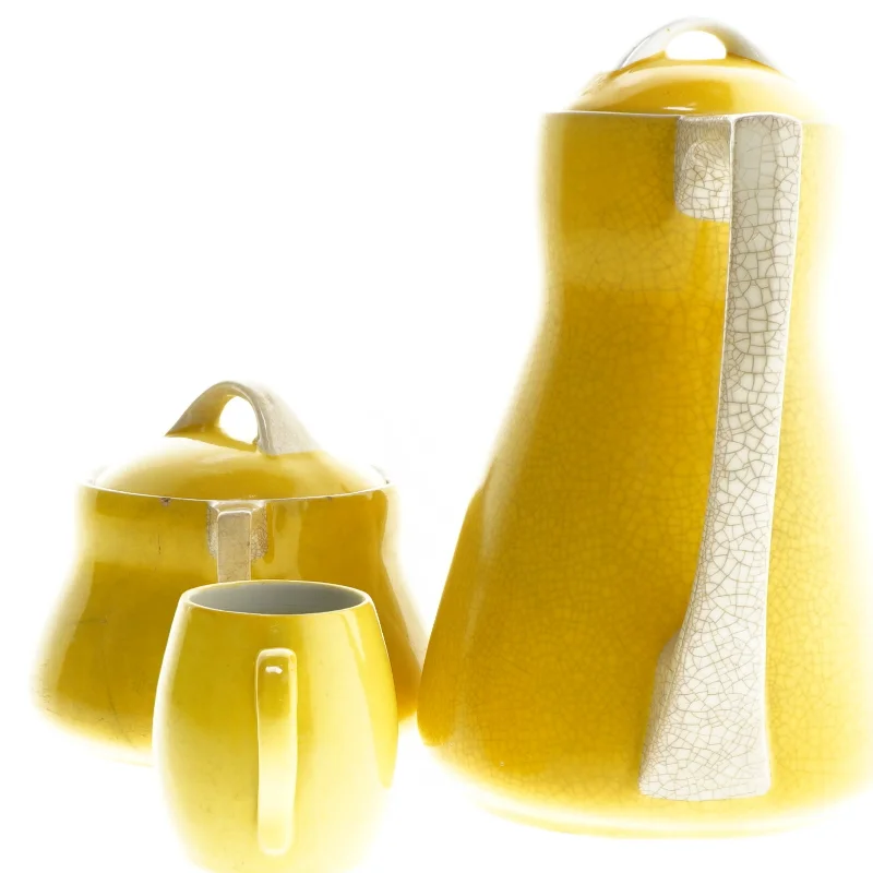 Gult kaffestel i keramik (str. 22, ø 12, 7 cm)