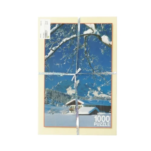 Puslespil med snedækket bjerglandskab