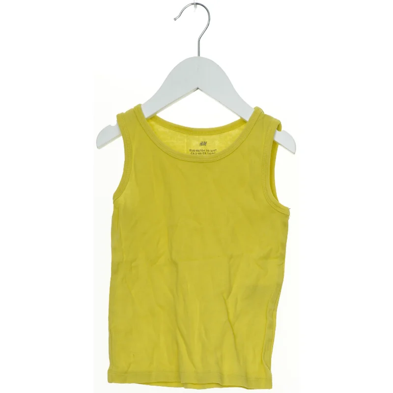 Gul tanktop fra H&M (str. 104)