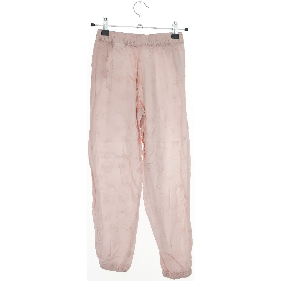 Lyserøde bukser med sommerfuglemønster fra H&M (str. 134)