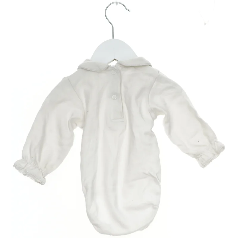 Baby bodystocking med blomsterdetaljer fra H&M (str. 68)