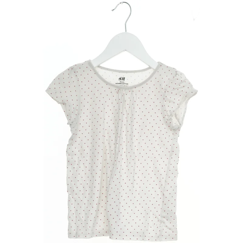 Kortærmet T-shirt med prikker fra H&M (str. 122)