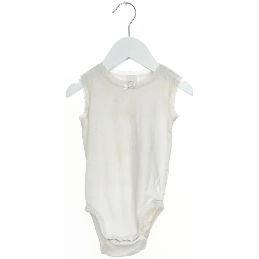 Hvid bodystocking til baby fra H&M (str. 86)