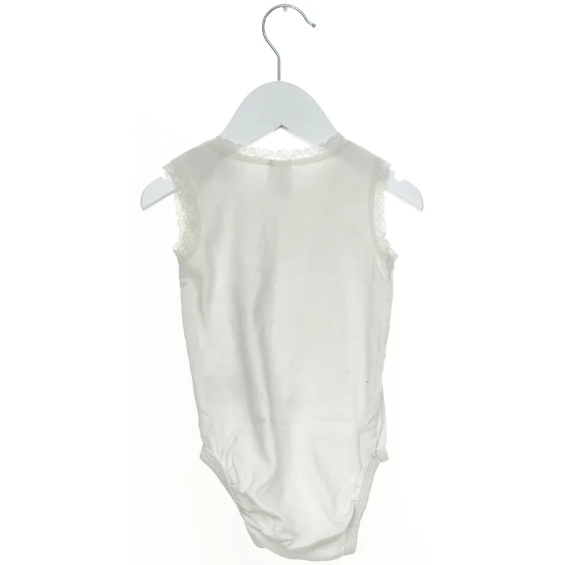 Hvid bodystocking til baby fra H&M (str. 86)