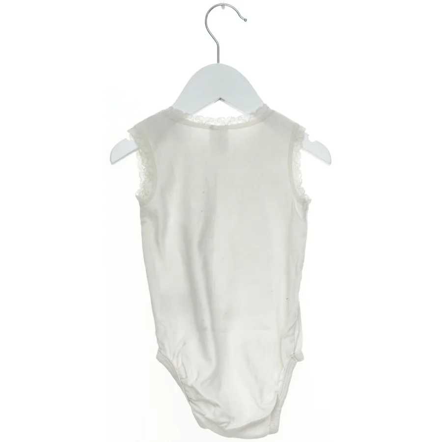Hvid bodystocking til baby fra H&M (str. 86)
