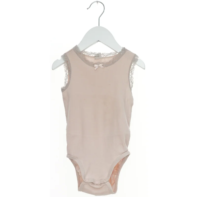 Body med blonde detaljer fra H&M (str. 86)