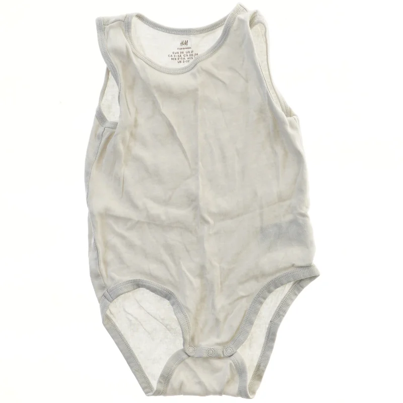 Hvid bodystocking til baby fra H&M (str. 98)