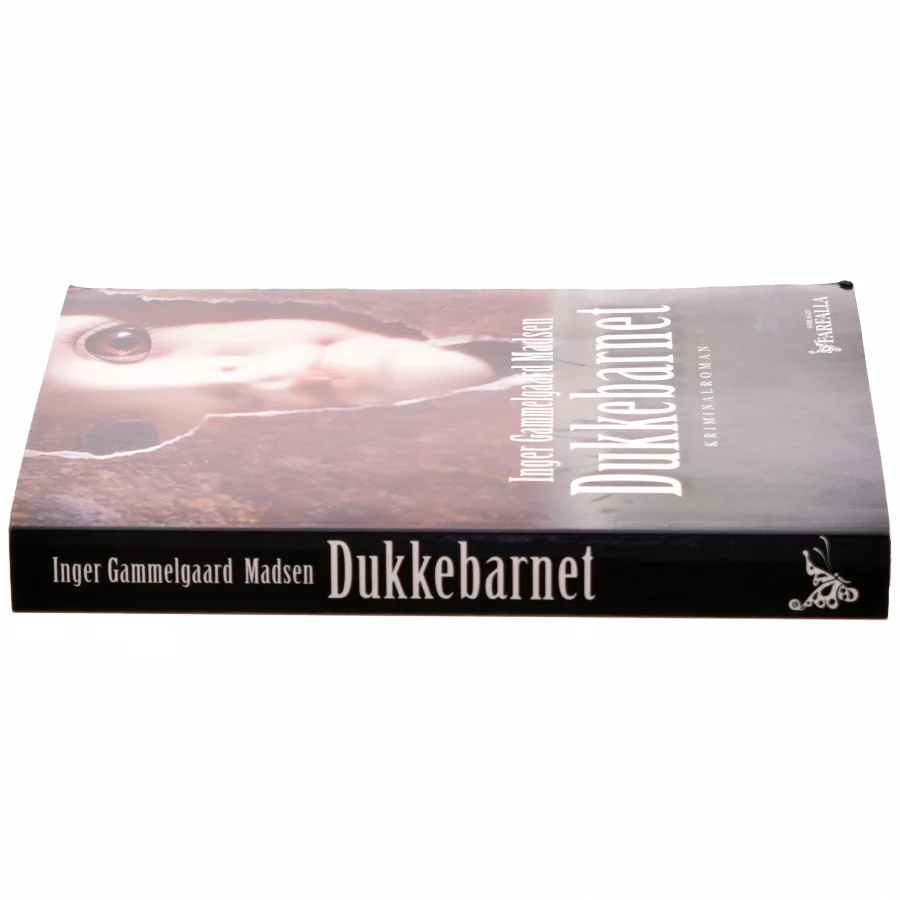 Dukkebarnet : kriminalroman af Inger Gammelgaard Madsen (Bog)
