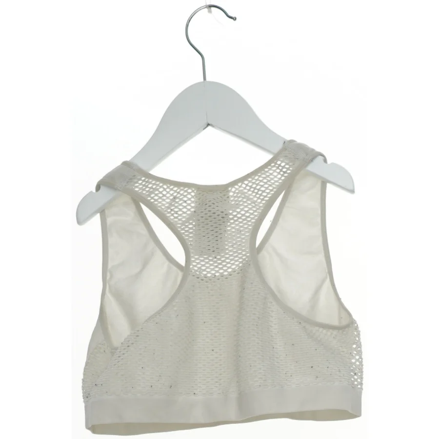 Sports-bh med mesh detaljer fra H&M (str. 158)