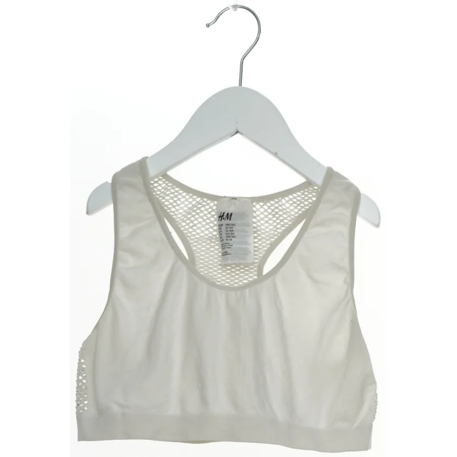 Sports-bh med mesh detaljer fra H&M (str. 158)