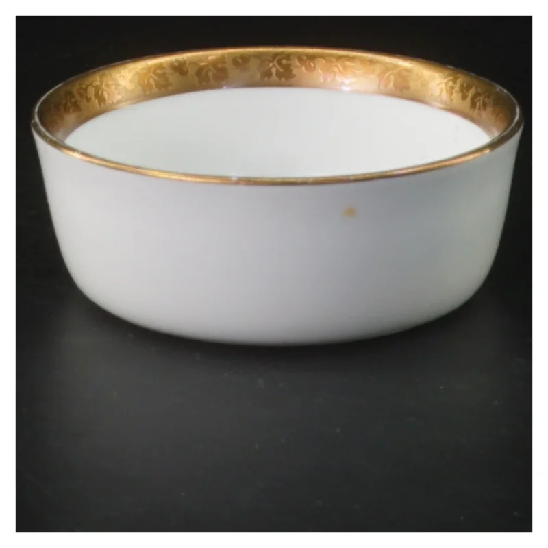 Dekorativ porcelænsskål med guldkant (str. 9x3 cm)