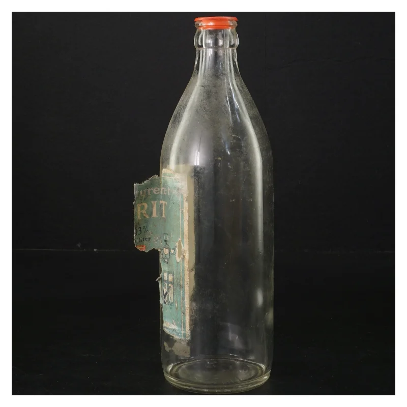 Gammel flaske med etiket (str. 22x6 cm)
