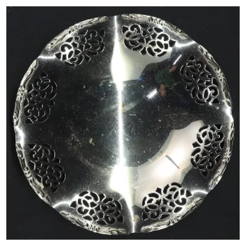 Dekorativ skål i sølvfarve (str. 14x2 cm)