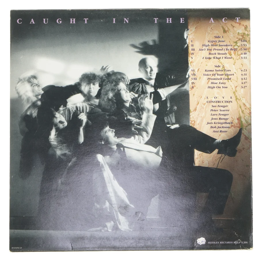 Caught in the Act LP album af Love Construction fra Medley Records