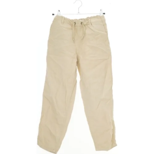 Beige bukser med elastisk talje fra Name It (str. 134)