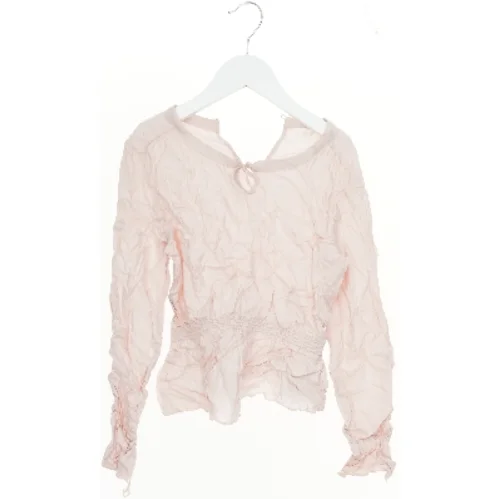 Let bluse med lange ærmer fra H&M (str. 140)