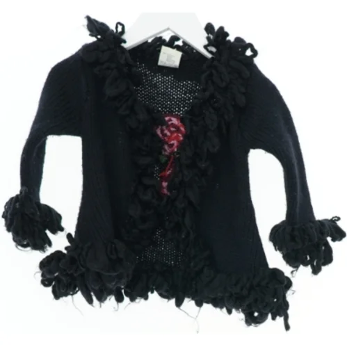 Sort cardigan med blomster fra H&M (str. 80)