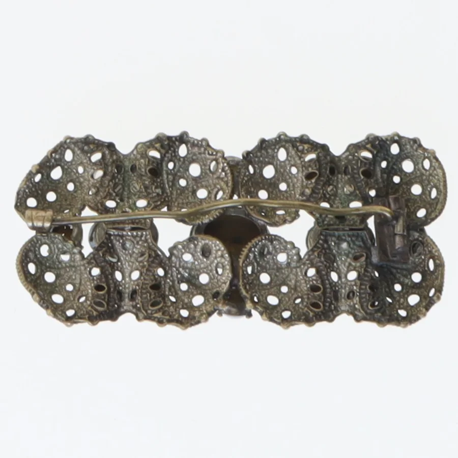 Dekorativ broche med blå sten (str. 5,5x2,5 cm)